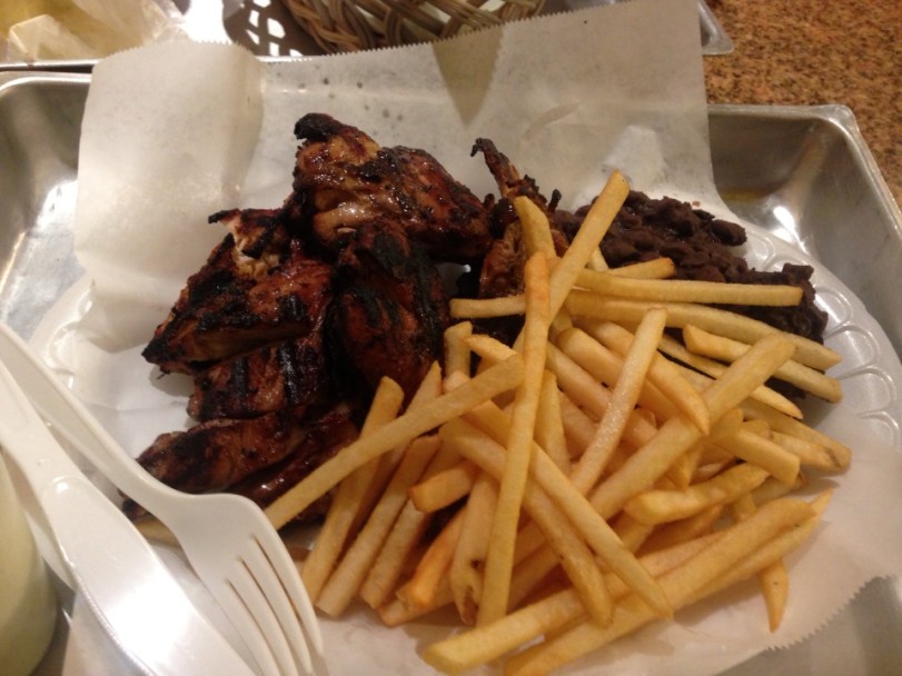 Roasted chicken, french fries, and black beans